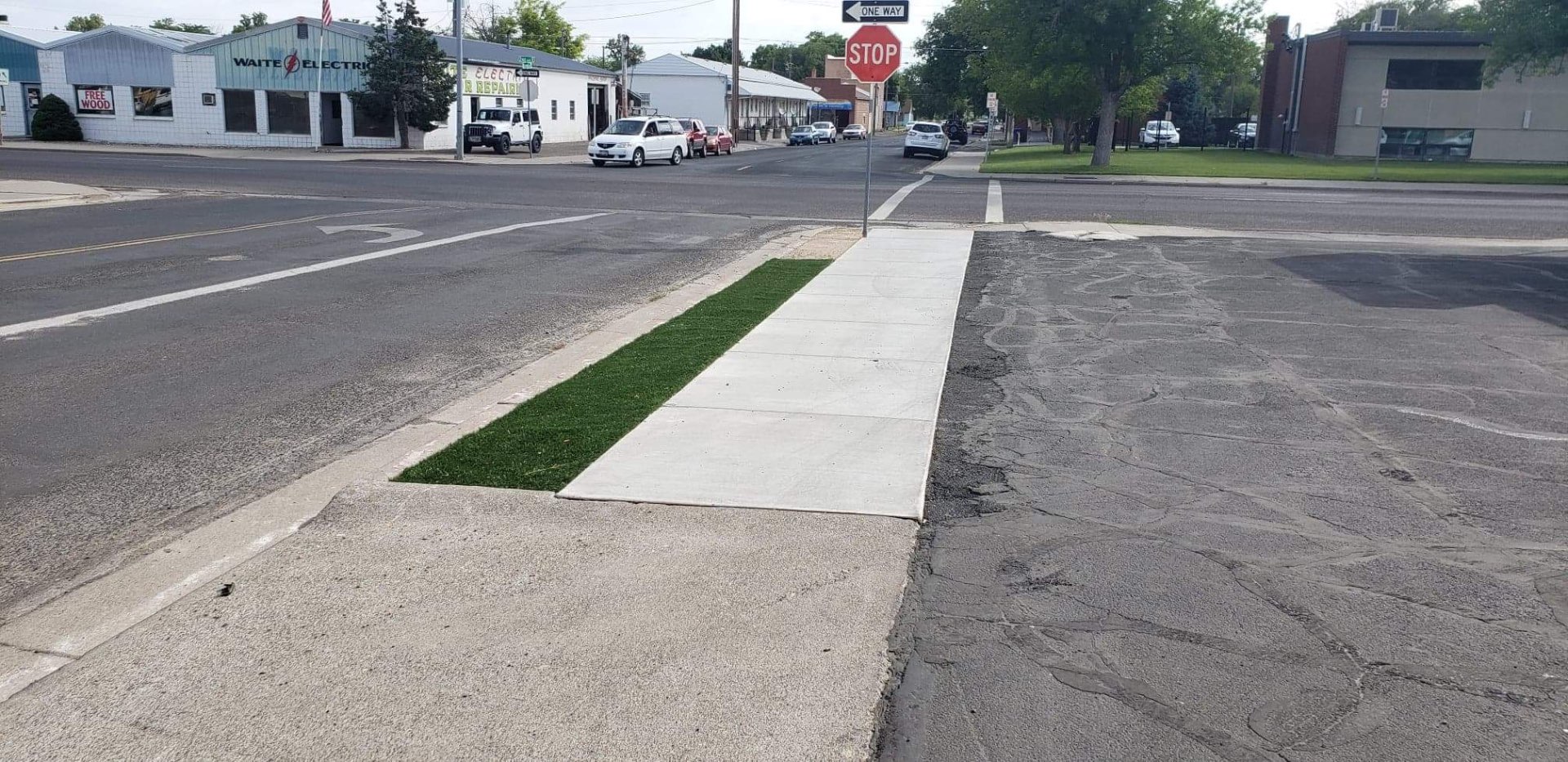 New concrete sidewalk with turf strip in downtown Kimberly